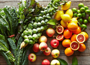 a group of fruits and vegetables on a wood surface Healthy Weight Loss Diets East Malling