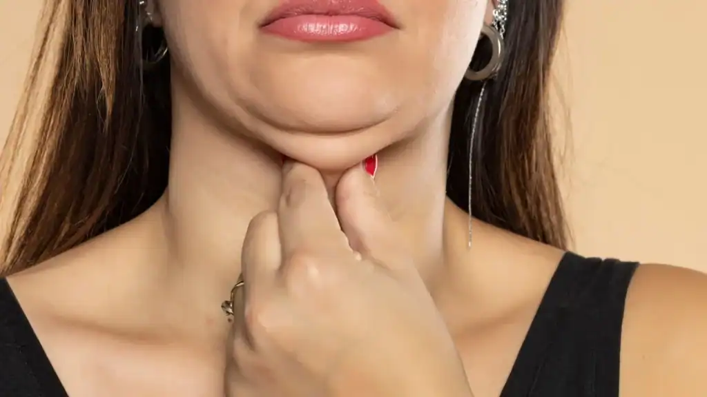 An image of a woman with double chin, sad, worried : Non Surgical Double Chin Removal Treatment in East Malling, UK